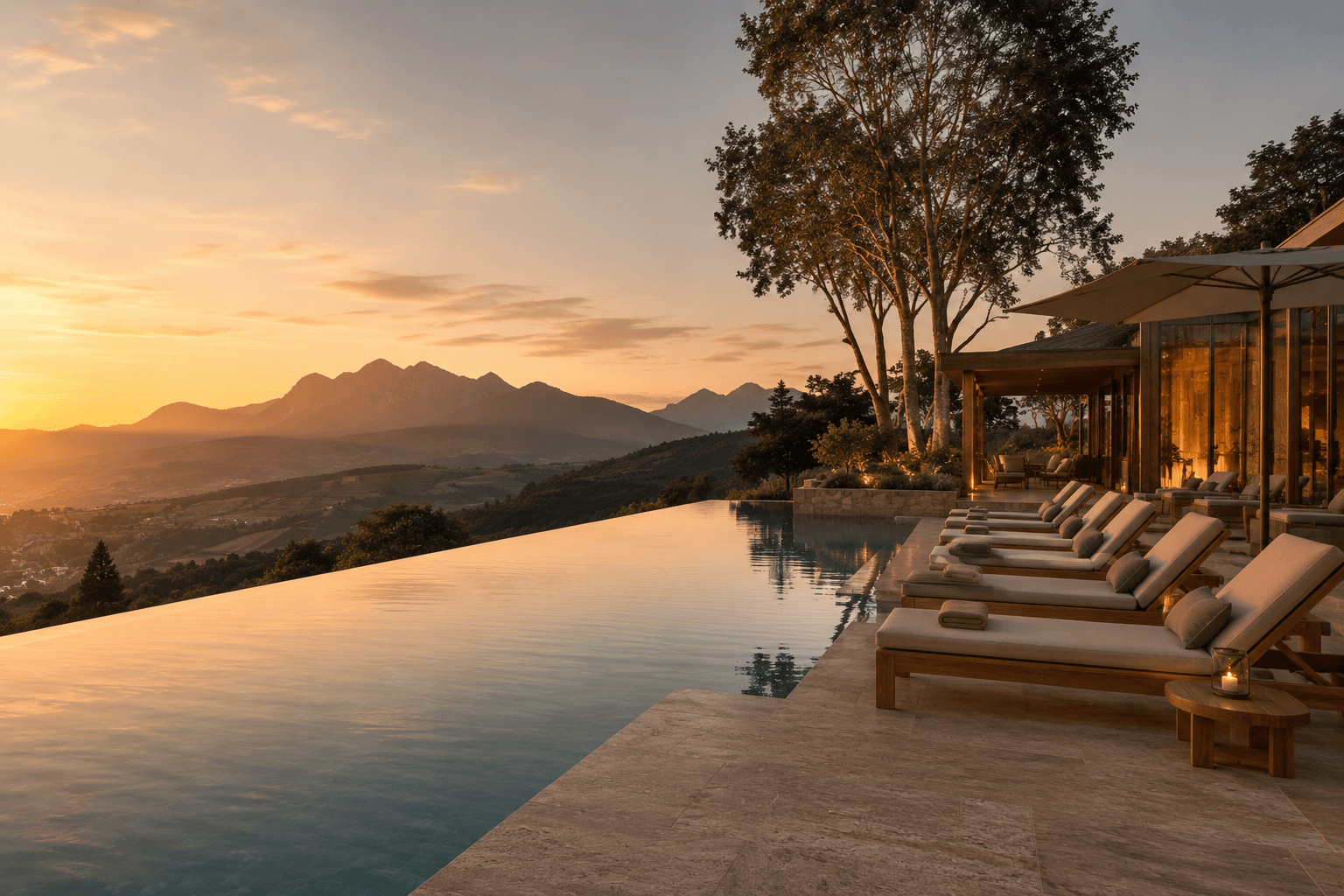 The rim pool at sunset with the mountains beyond
