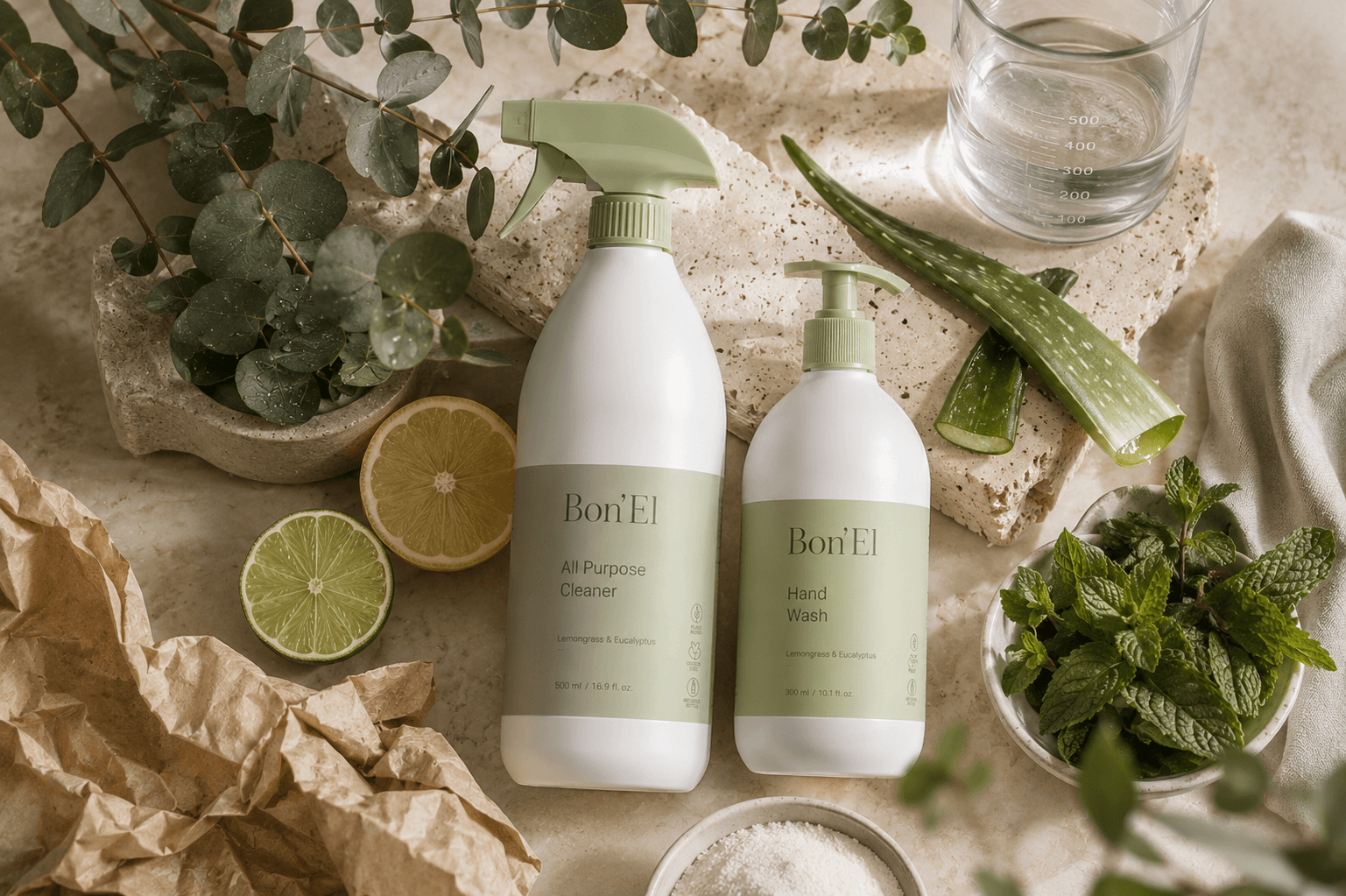 Bon'El all purpose cleaner and hand wash surrounded by lemon, lime, aloe, mint and eucalyptus