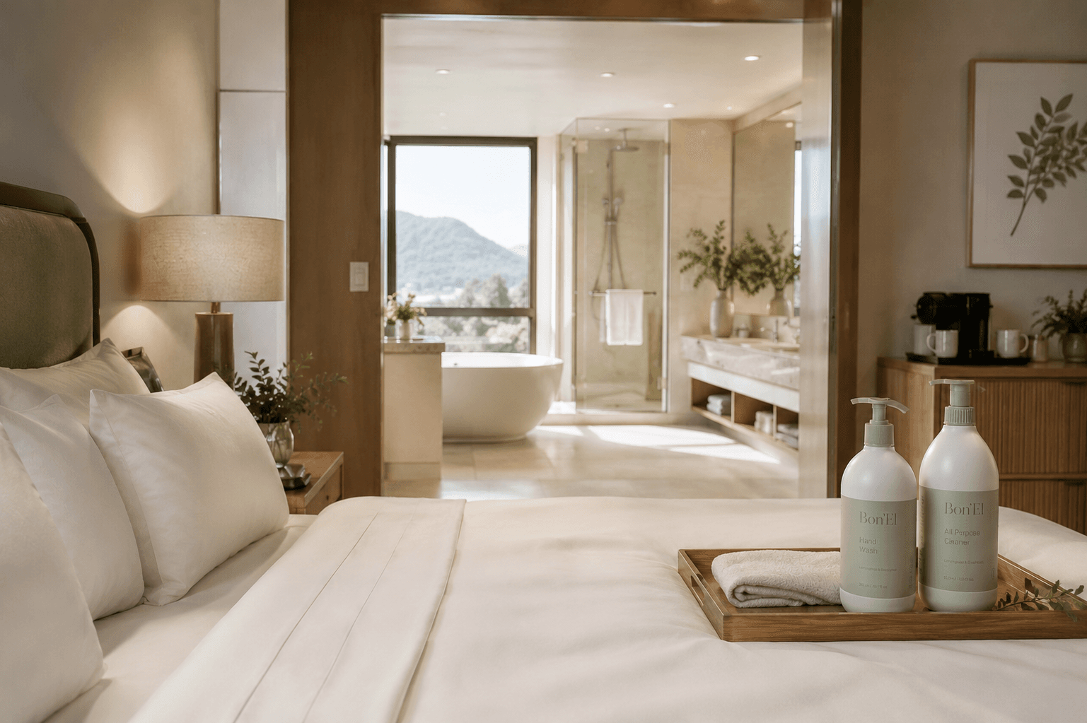 A serene guest suite with mountain views and Bon'El bottles on a tray