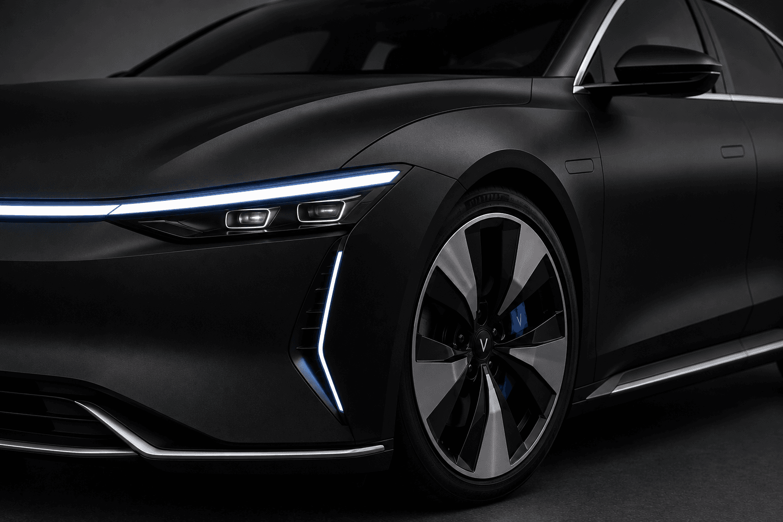 Matte-black Velora sedan close-up